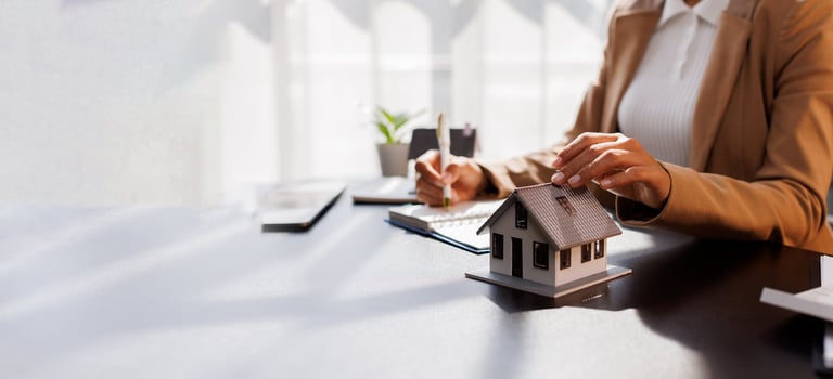 Real estate broker signing mortgage agreement