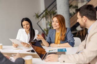 Businesswoman discussing with coworkers at meeting