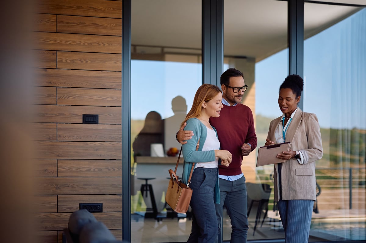 Real estate agent meeting with clients