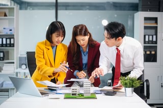 Asian team member working on real estate projects