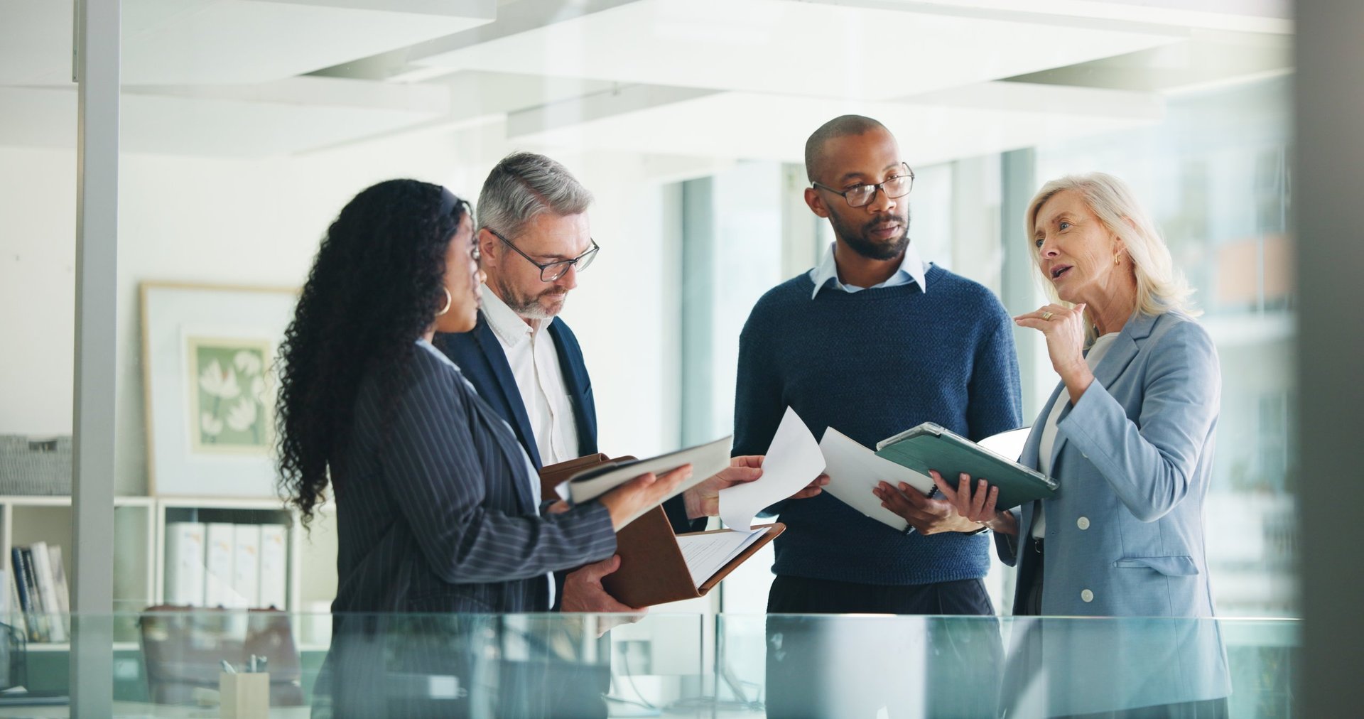 Business team analyzing investment data and market reports