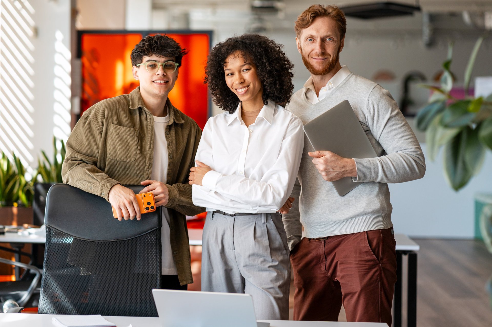 Confident real estate team in modern office