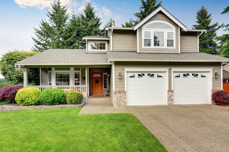 Beautiful home with double garage and manicured lawn